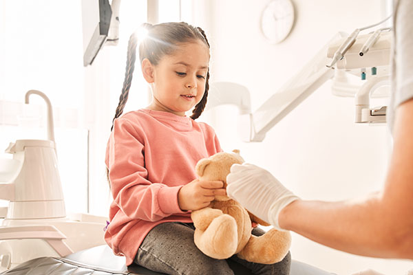 What Approach Does A Kid Friendly Dentist Take Towards Calming A Child Down?